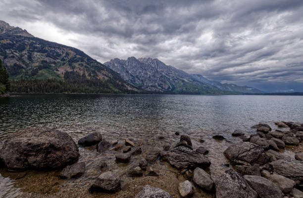 The Grand Tetons viewed from the shore of Jenny Lake on a stormy, August day.