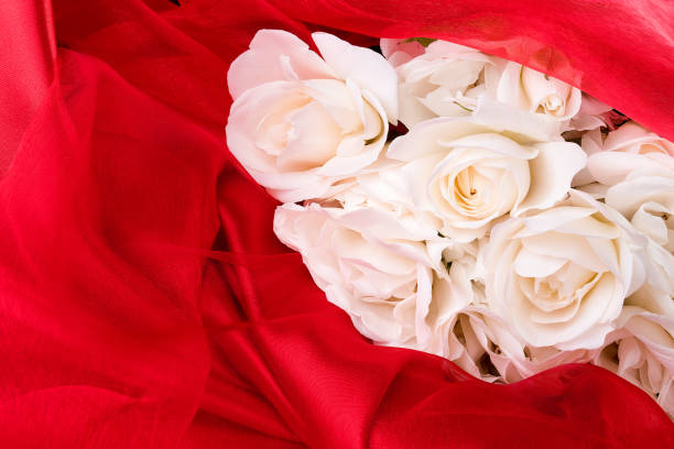 Bouquet of white-coloured roses on a brown paper box - delivered before a wedding