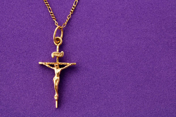 Gold crucifix on purple background - horizontal format
