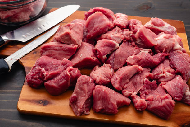 istock Many Chunks of Pork Shoulder with Knives on a Cutting Board 2176793888