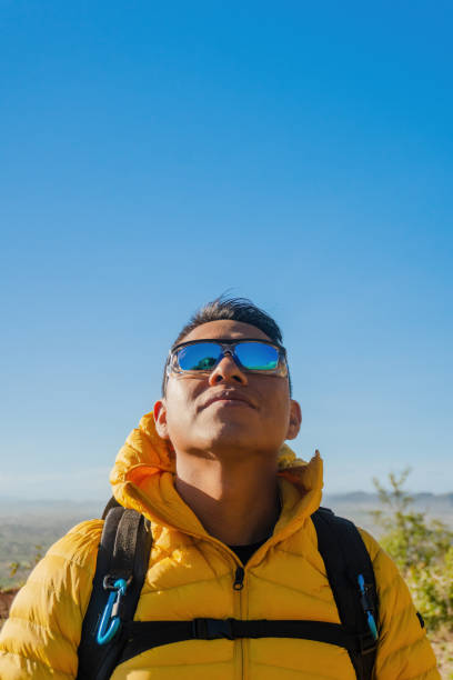 istock Young Adventurer Capturing Happiness on the Mountain Peak 2176795705