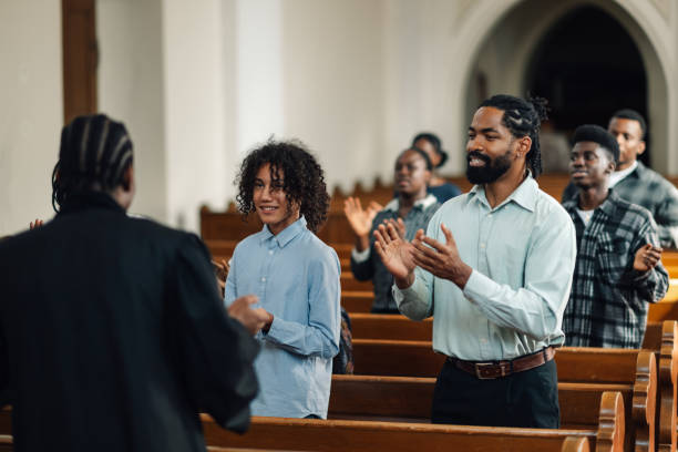 istock Congregation clapping along to gospel music in church 2176799556