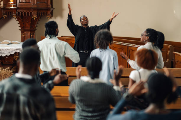 istock African american pastor leading congregation in prayer 2176799585