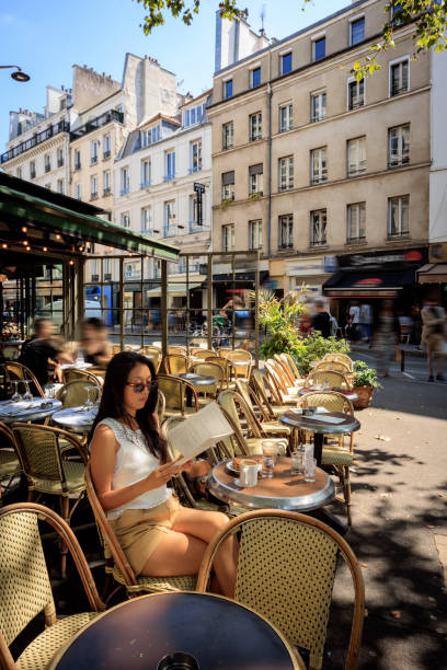 istock Lady having coffee in Paris sidewalk cafe 2176810499