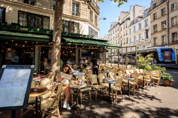 Lady having coffee in Paris sidewalk cafe