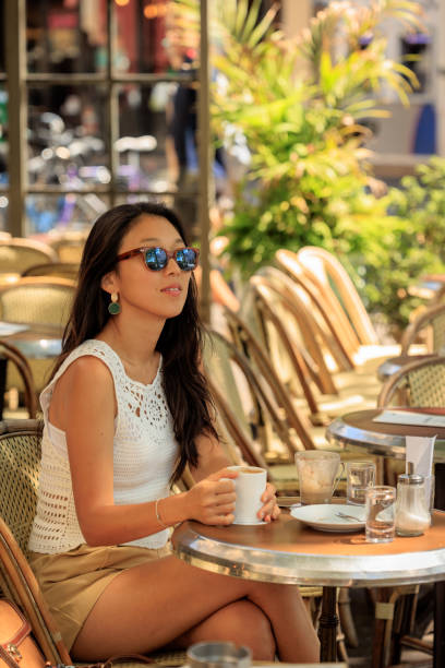 istock Lady having coffee in Paris sidewalk cafe 2176810546