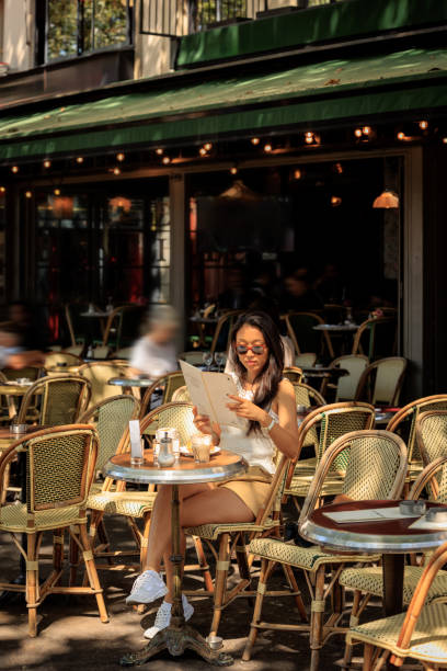 istock Lady having coffee in Paris sidewalk cafe 2176810557