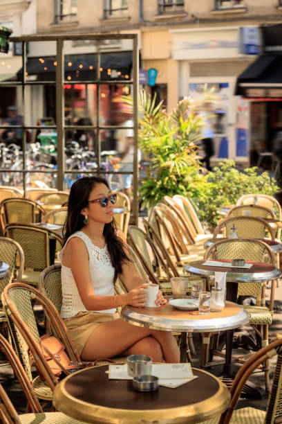 istock Lady having coffee in Paris sidewalk cafe 2176810580