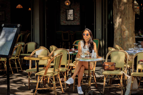 istock Lady having coffee in Paris sidewalk cafe 2176810594