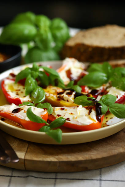 istock Mini peppers stuffed with cream cheese in olive oil with basil 2176815115