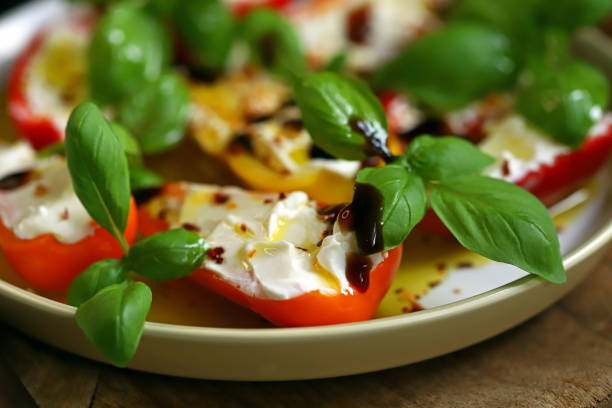 istock Mini peppers stuffed with cream cheese in olive oil with basil 2176815117