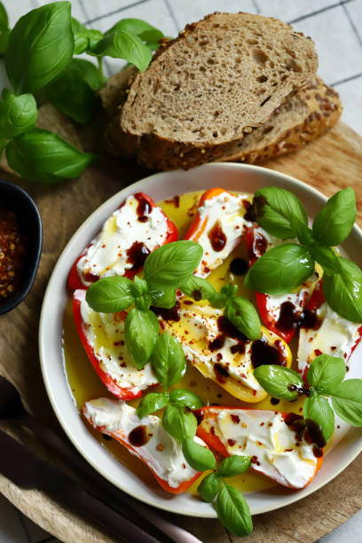 istock Mini peppers stuffed with cream cheese in olive oil with basil 2176815120