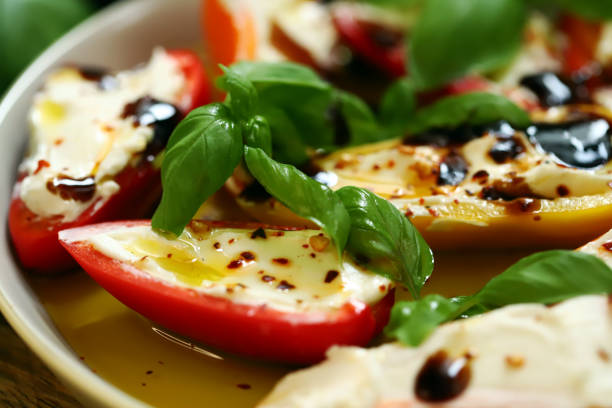 istock Mini peppers stuffed with cream cheese in olive oil with basil 2176815137