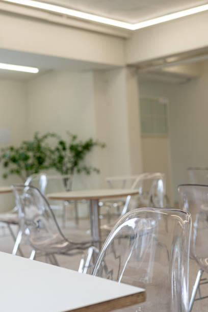 istock Seating inside the cafe or restaurant, with transparent chairs and white tables. 2176864567