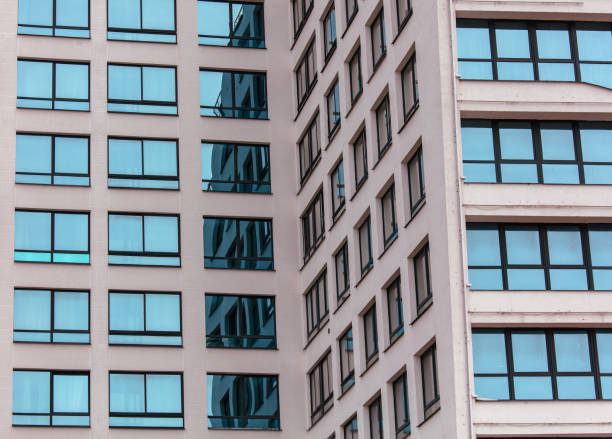 istock A tall building with many windows and a glass facade 2176870795