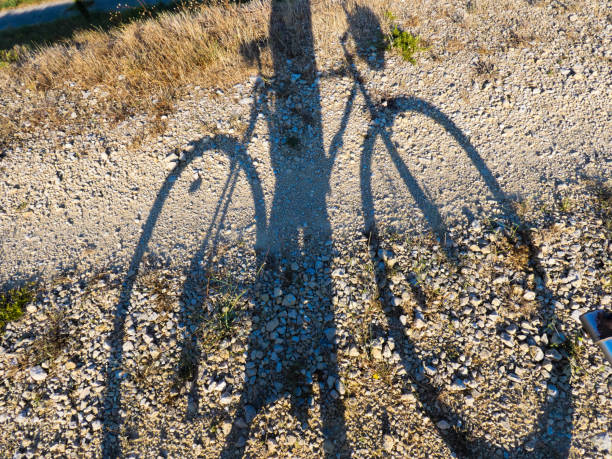 Shadow photo of a cyclist on his bike.