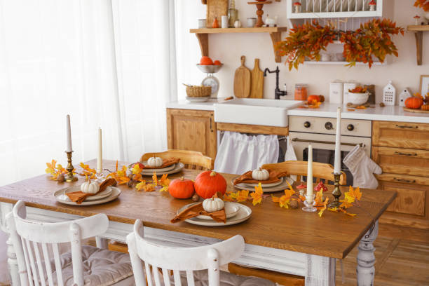 istock Kitchen, dinning table decorated with pumpkin, candle and leaves for Halloween, Thanksgiving day 2176874872
