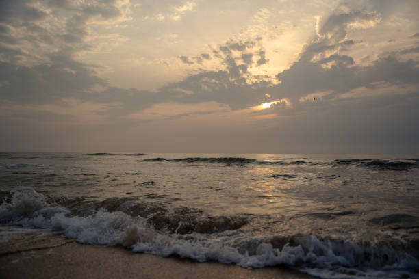 istock Small waves hitting the coast on a sand beach 2176875136