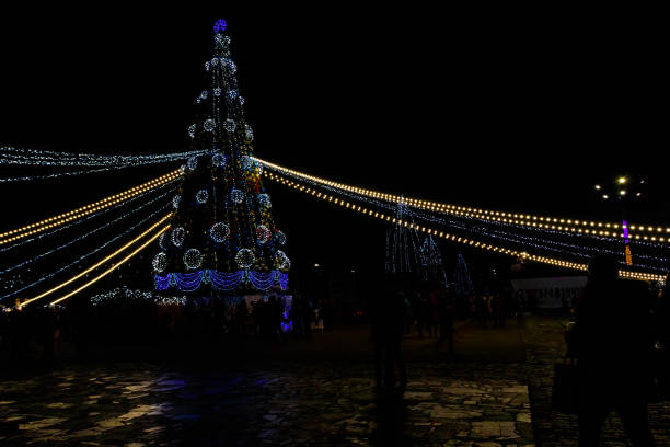 Kremenchug, Ukraine - January  6, 2018: Ornate and illuminated Christmas tree in the city centre