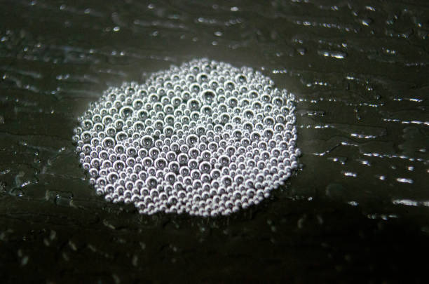 istock Top view of small bubbles clustered together on a dark background. 2176884199