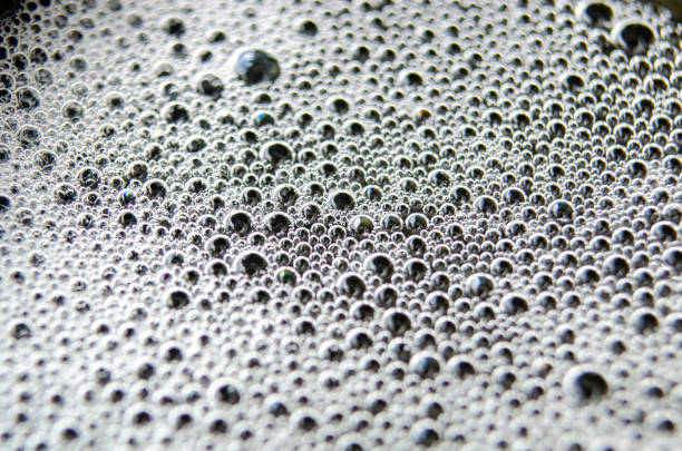 Close up view of bubbles on dark background with customizable space for text.
