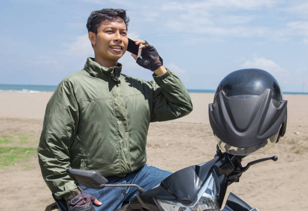 istock Indonesian Man taking a phone call on the dirt road. 2176884444