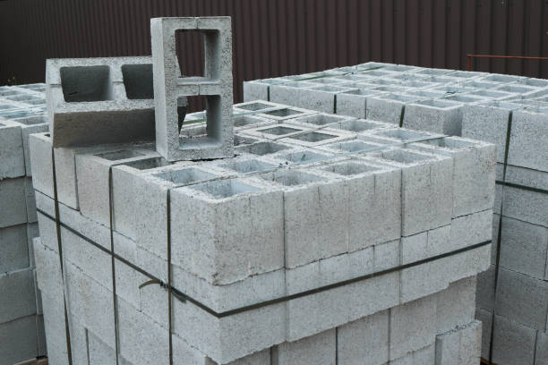 istock Hollow concrete wall blocks assembled on pallets. Construction concrete block. Vibration-pressed building block. 2176887245