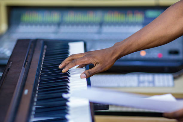 istock Audio visual systems sound system mixers instruments hands playing tuning piano key boards details texture 2176889663
