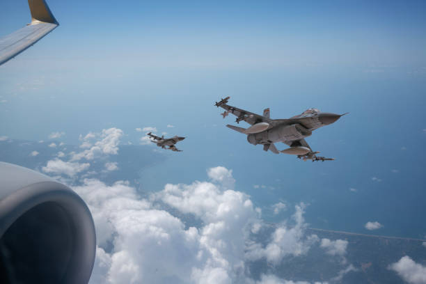 istock F-16 Jet fighters from commercial airplane window. 2176891543