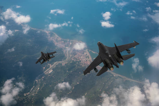istock SU-35 Jet fighters flying over clouds. 2176894200