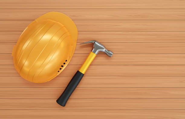 Hard hat with hammer on wood background. 3d-rendering
