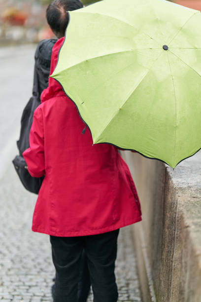 istock Tourists in rainy weather 2176897219