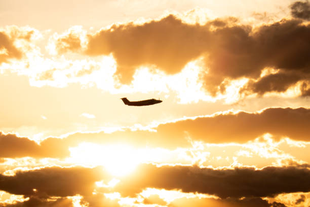 A NSW Ambulance Service Beech King Air 350C plane, registration VH-AMR, taking off from Sydney Kingsford-Smith Airport and heading to Wagga Wagga. This image was taken from the 10th floor roof of a public carpark at the domestic terminal on a sunny afternoon approaching sunset on 5 October 2024.