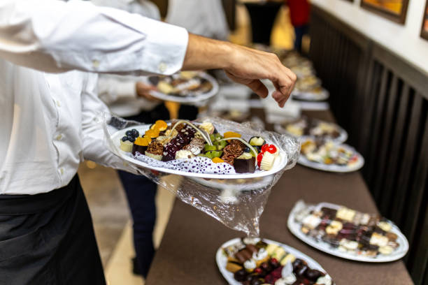 istock Chef serving beautifully plated desserts at an elegant event 2176911900