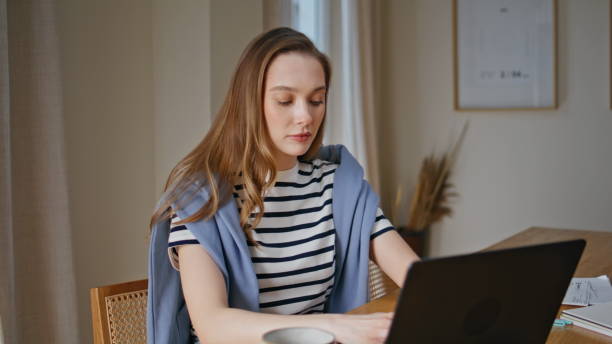 istock Woman freelancer working laptop from home closeup. Manager focused on computer 2176912290