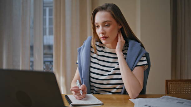 istock Professional tutor teaching online looking laptop web camera at home closeup. 2176913761