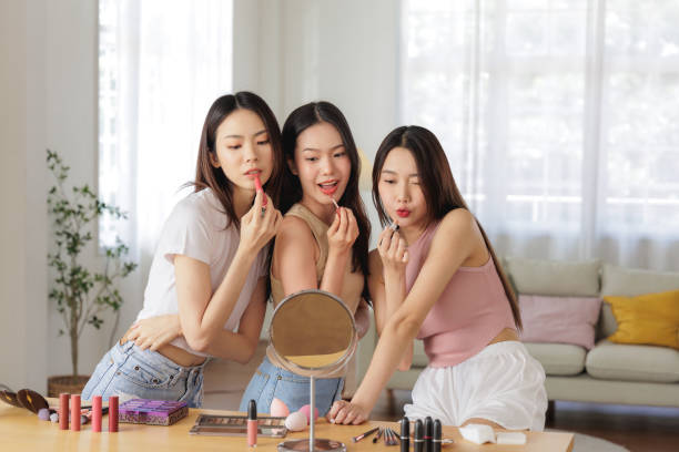 istock Three Young Women Applying Makeup Together in a Bright and Cozy Room 2176918527