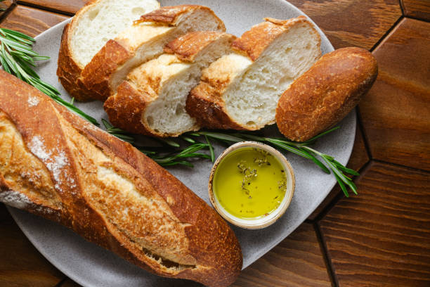 istock French baguette with olive oil and fresh rosemary on a kitchen table 2176919172