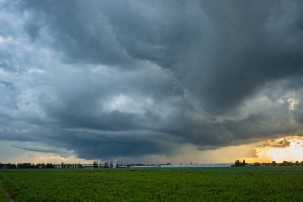 istock Supercell storm over the plains at sunset 2176921164