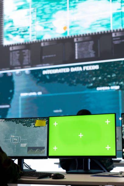 istock Intelligence analyst reviews air and sea activity next to an isolated mockup 2176922262
