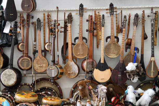 The traditional uzbek musical instruments such as rubab, sato, dutor and doira for sale. Bukhara. Uzbekistan