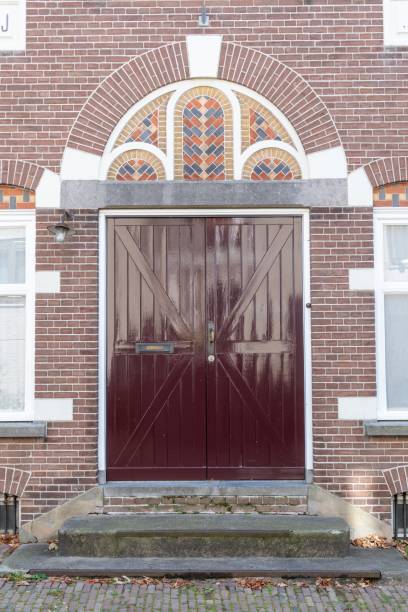 istock large door with decorations on old town house 2176931030