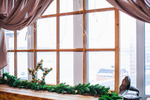 istock a decorated windowsill with Xmas star and  gramophone toy 2176932534