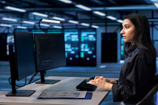 istock Woman in server room making sure sensors are functioning optimally 2176937174