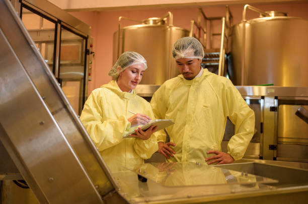 istock Professional winemaker controlling wine making process and quality at winery factory 2176937919