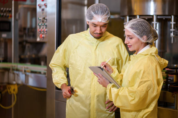 Professional winemaker controlling wine making process and quality at winery factory stock photo