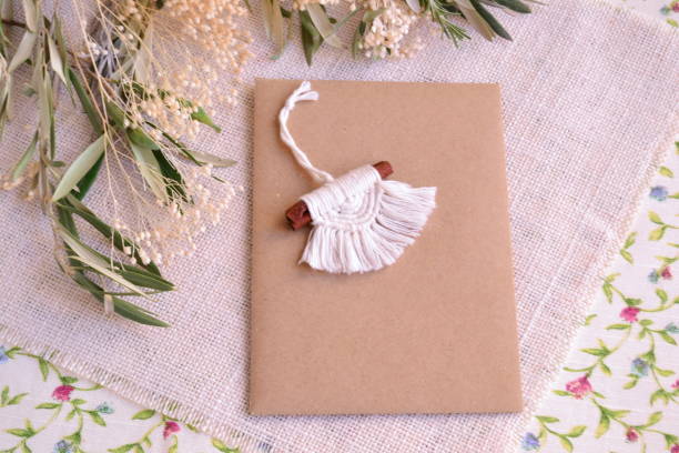 Wedding invitation mockup copy space and favor for guests macrame gift key chain