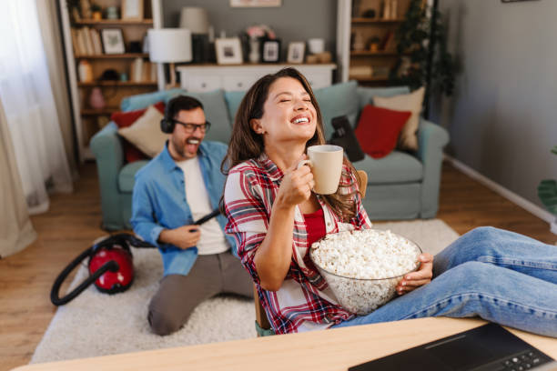 istock Happy couple during home cleaning routine 2176941411