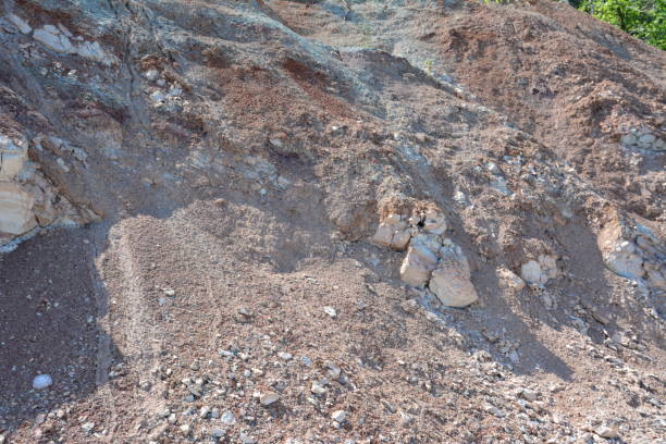 istock a large rock with some rolling stones isolated 2176945838