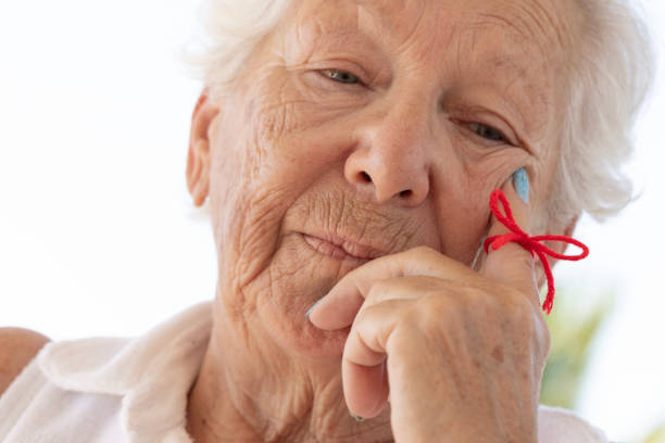 istock Elderly Woman with a Memory Ribbon 2176946623